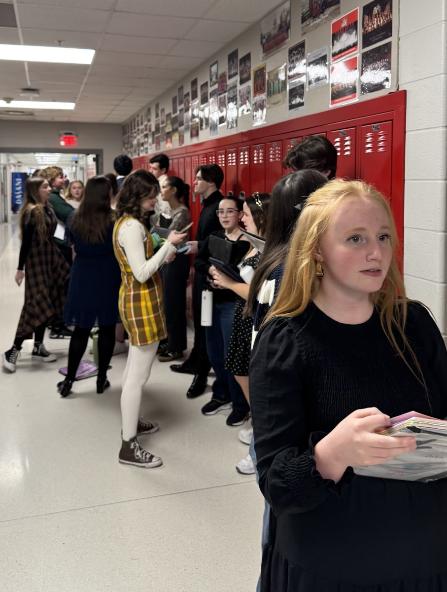 Junior Callie Painter waits in line to audition for this year's solo competition. Solo competition is an opportunity for students to share their passion for music by representing Center Grove while the choir program takes their talent to competitions around the nation.  “I think it’s a good life thing to just put yourself out there and learn to do hard and uncomfortable things… and to not be nervous about things that I can’t control,” Painter said.